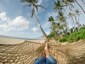 lying in a hammock on the seashore