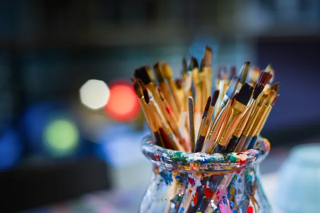 glass of brushes - indicating a hobby